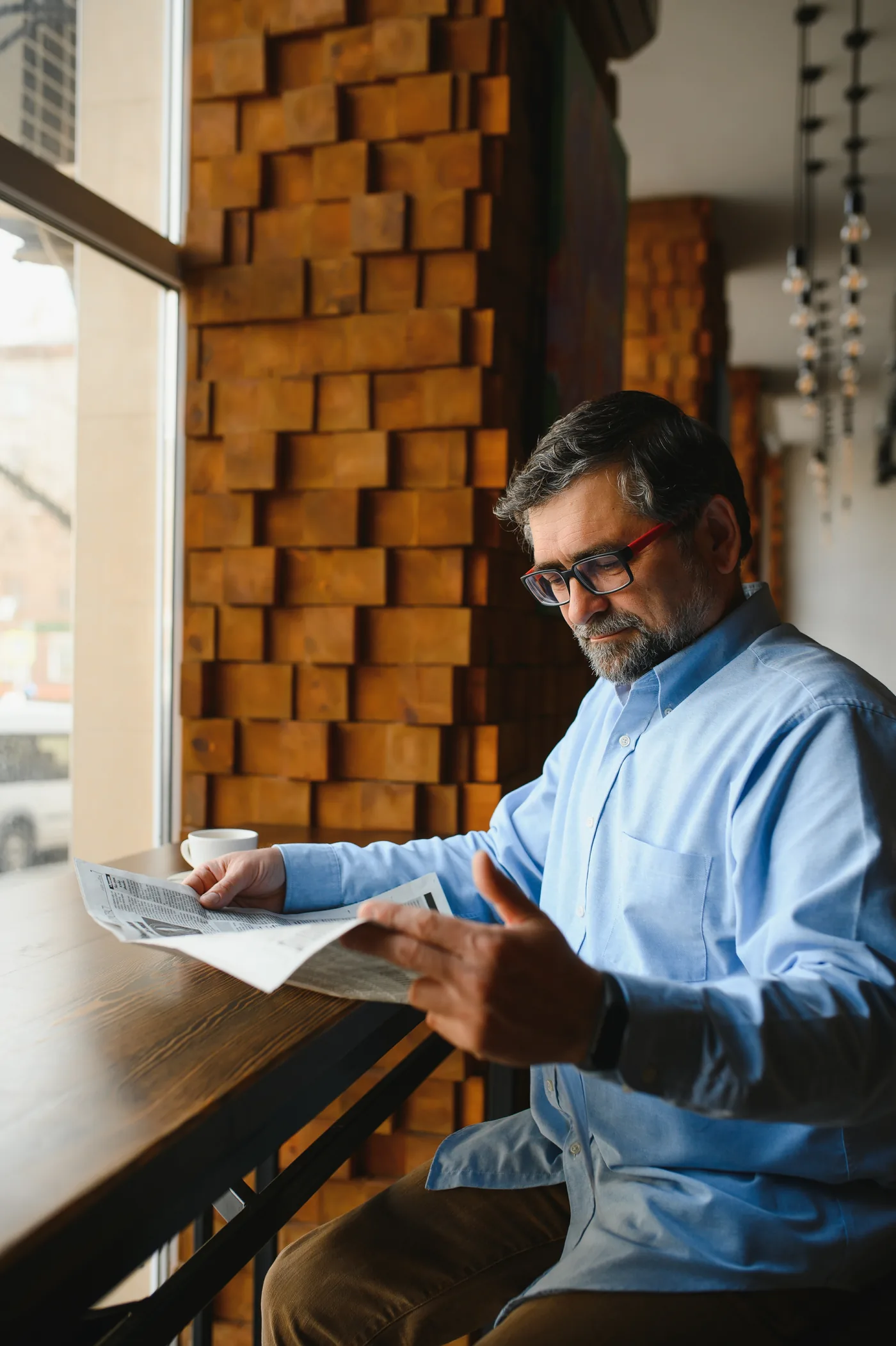 Person relaxing at home with a hopeful expression